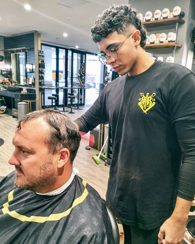 The Quiet Bar storefront at night with warm glow